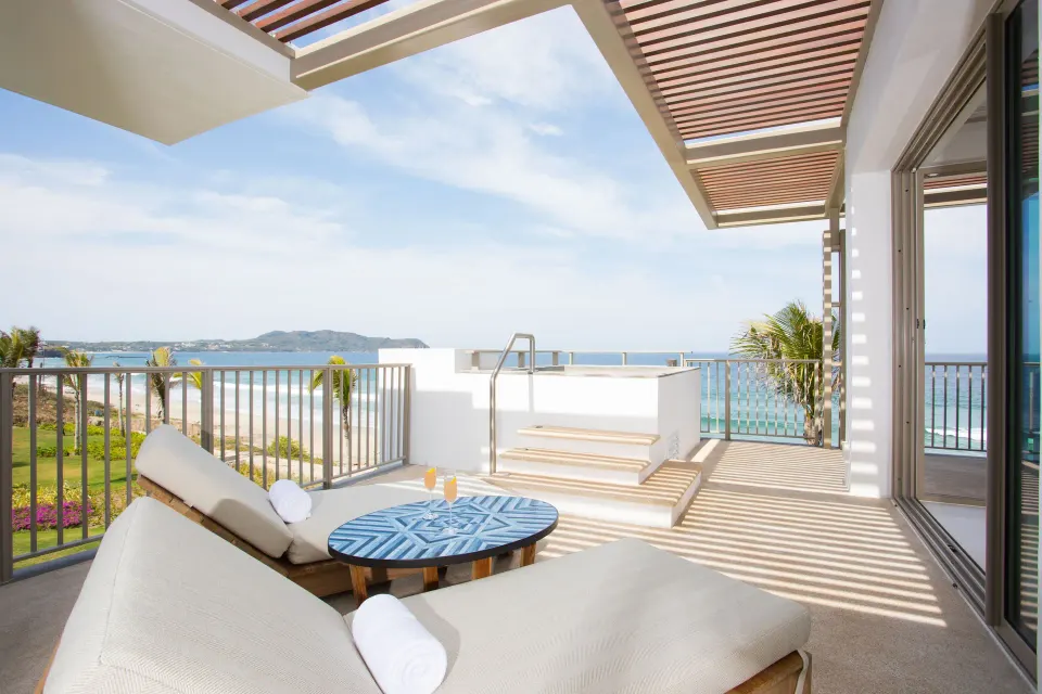 Oceanfront suite terrace with loungers, private pool, and ocean view at Conrad Punta de Mita.