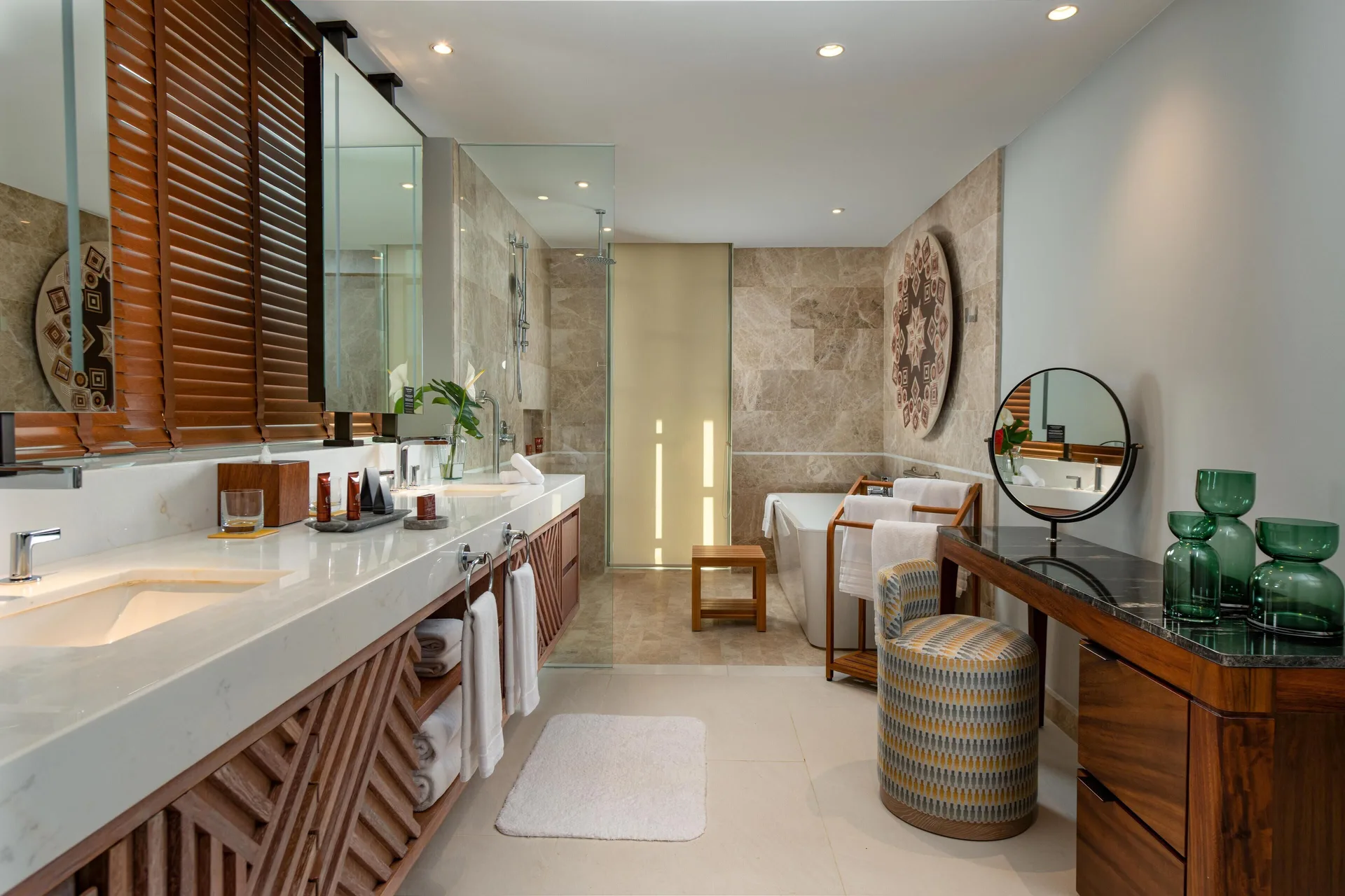 Spacious suite bathroom with double vanity and soaking tub at Conrad Punta de Mita.