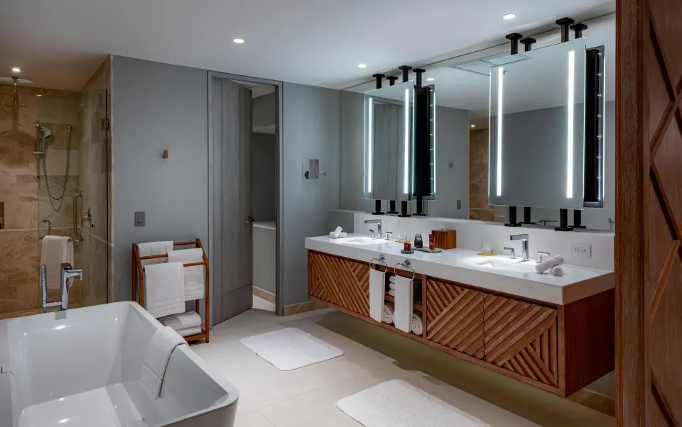 Superior Suite Ocean View bathroom with tub, shower, and double vanity at Conrad Punta de Mita.