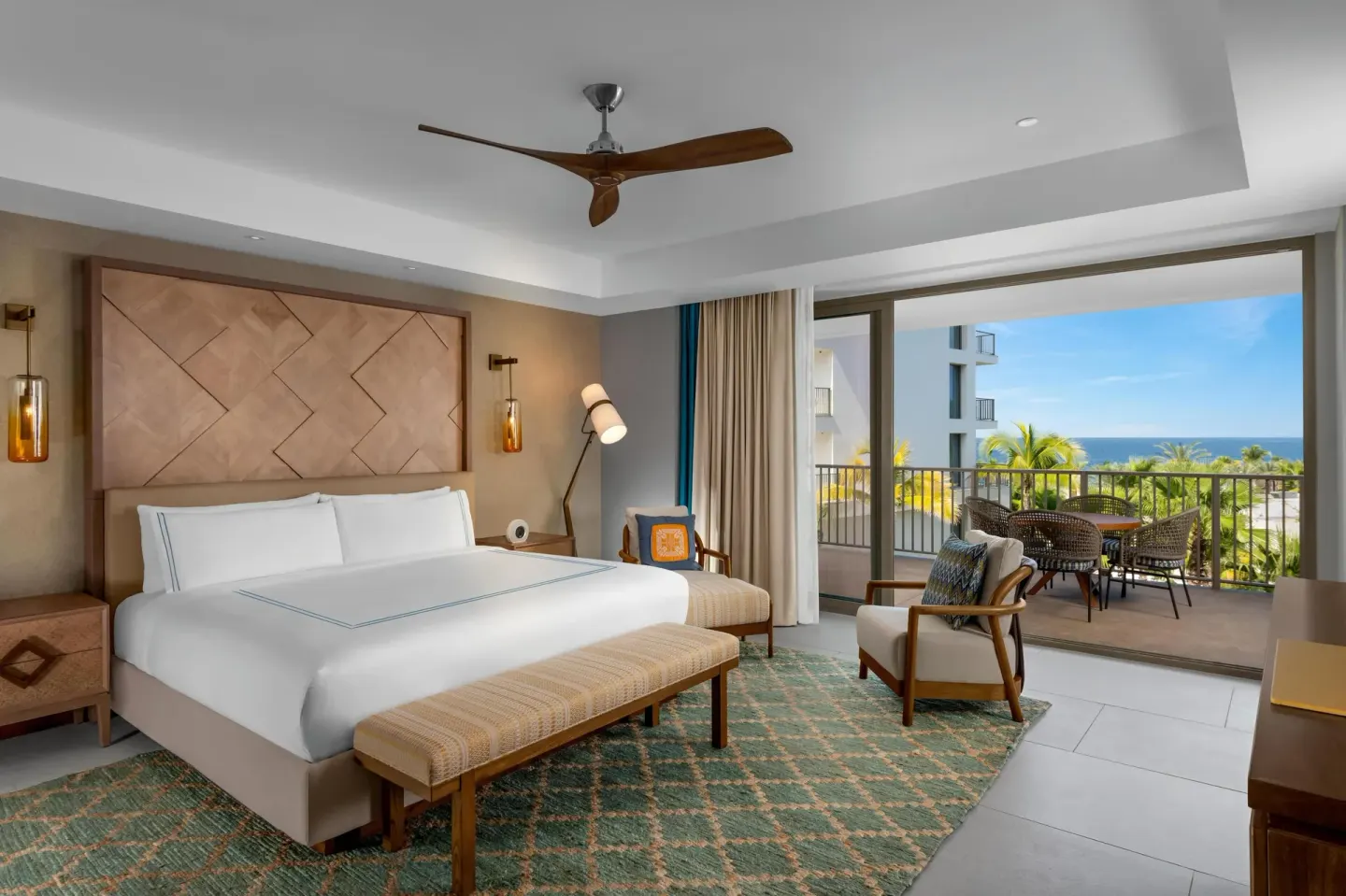 Superior Suite Ocean View king bedroom with balcony and ocean beyond at Conrad Punta de Mita.