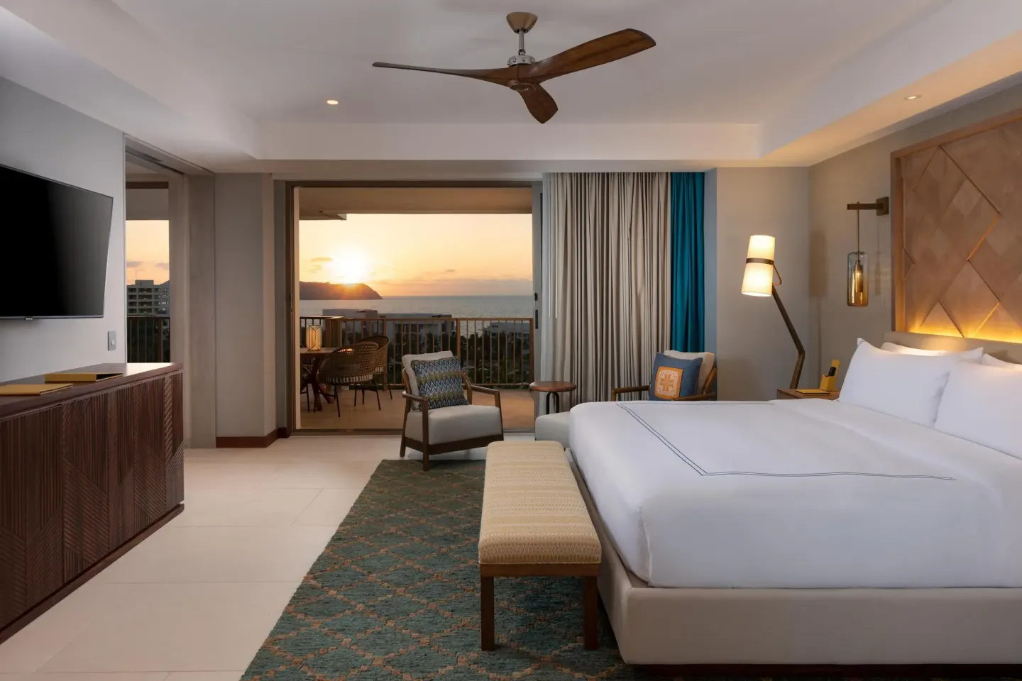Superior Suite Ocean View king bed with sunset balcony view at Conrad Punta de Mita.