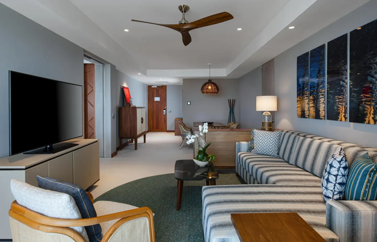 Superior Suite Ocean View living room with sectional sofa and TV at Conrad Punta de Mita.