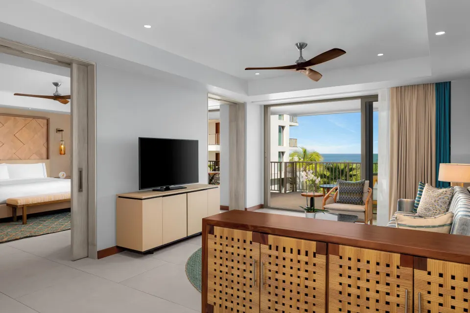 Superior Suite living area and partial ocean view balcony at Conrad Punta de Mita.
