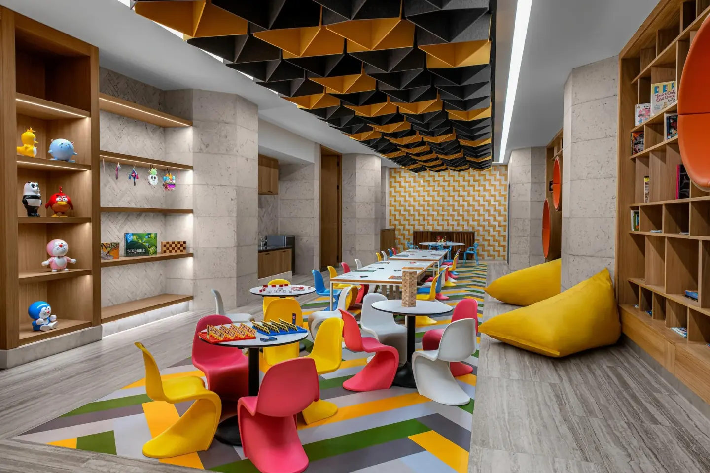 Colorful children's playroom with games and shelves at Conrad Tulum Riviera Maya.