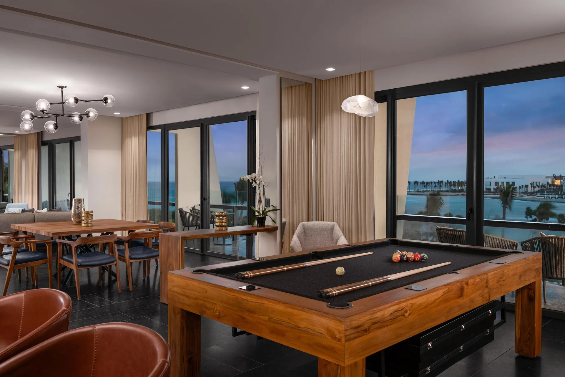 Ceiba Presidential Suite game table and dining area at Conrad Tulum Riviera Maya.