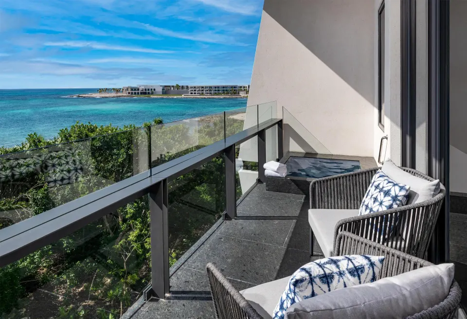 Partial Ocean View Guestroom balcony with ocean view at Conrad Tulum Riviera Maya.