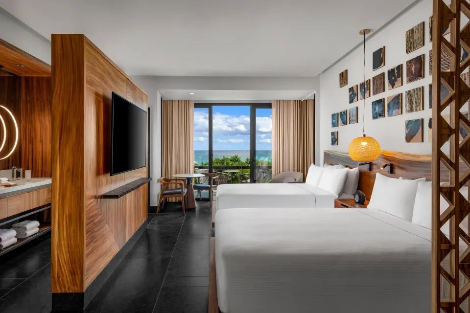 Partial Ocean View Guestroom with two beds at Conrad Tulum Riviera Maya.