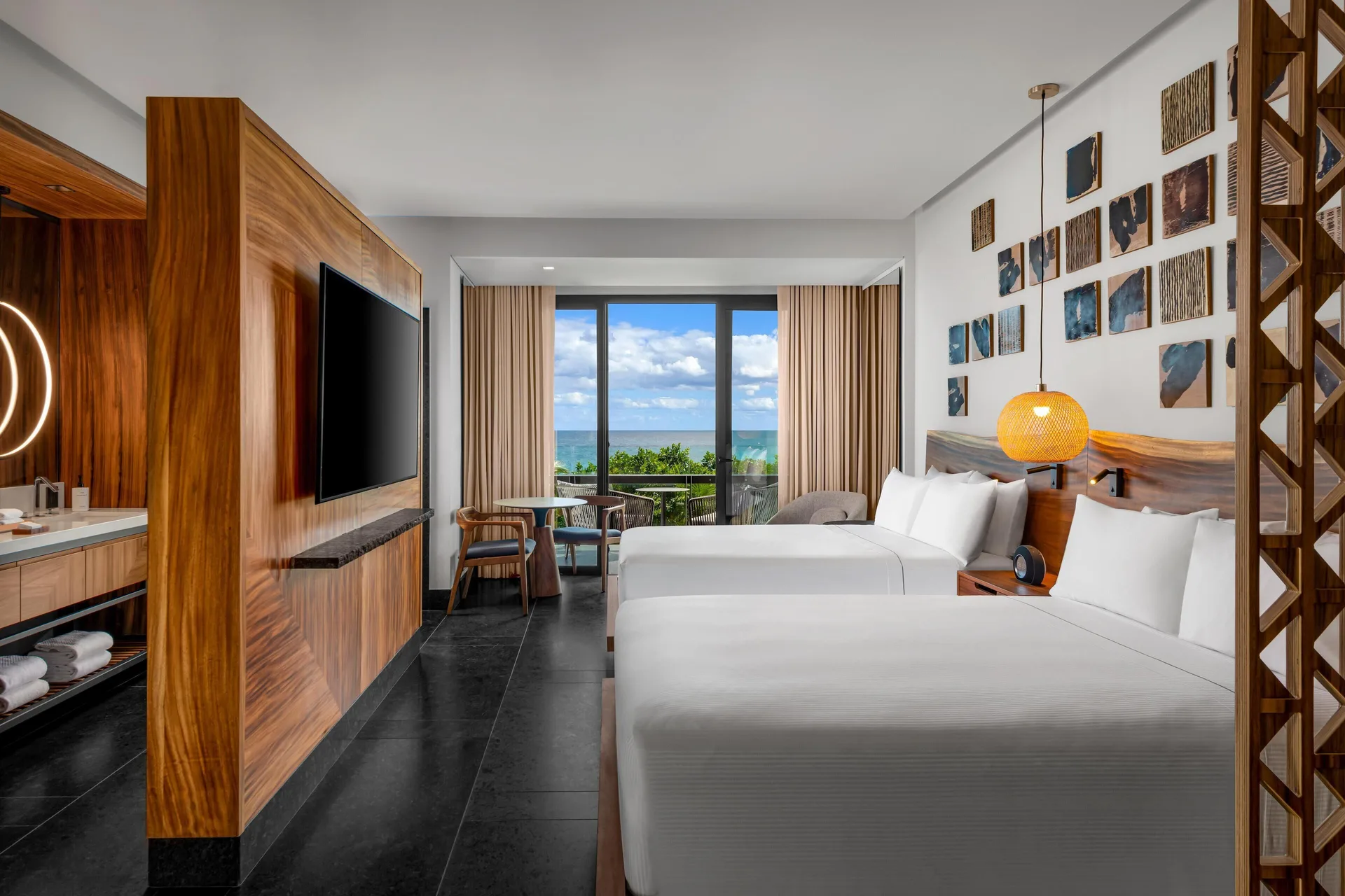 Partial Ocean View Guestroom with two beds at Conrad Tulum Riviera Maya.