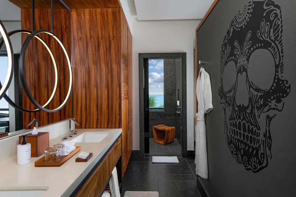 Partial Ocean View Guestroom bathroom vanity and shower view at Conrad Tulum Riviera Maya.