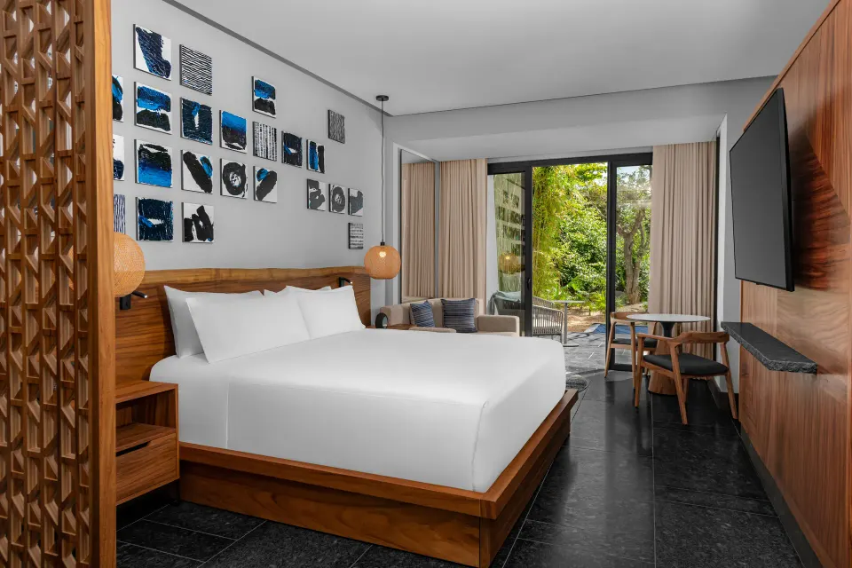 Accessible guest room with king bed and terrace at Conrad Tulum Riviera Maya.