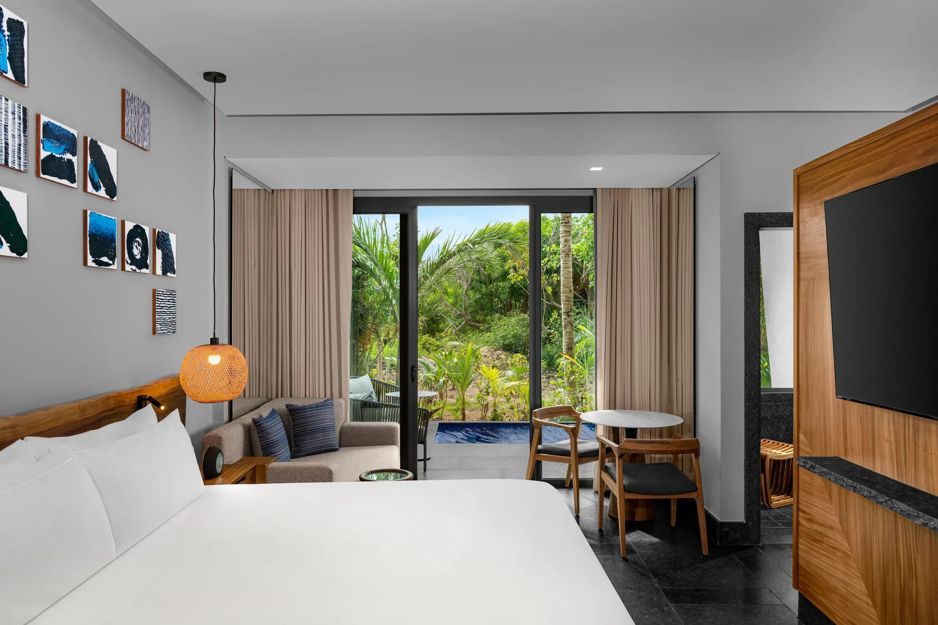 Ceiba Tropical View suite king bed and balcony at Conrad Tulum Riviera Maya