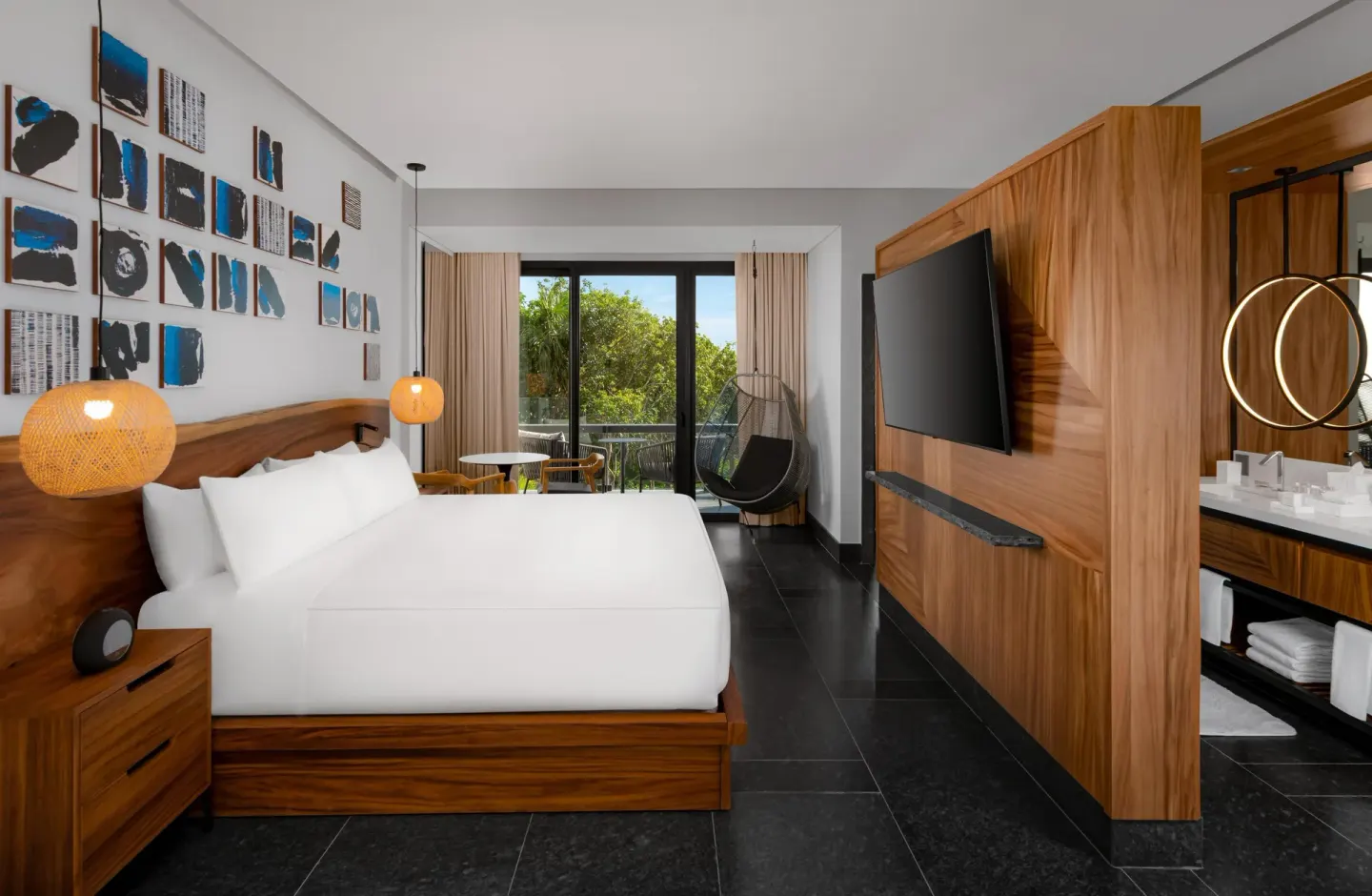 Ceiba Tropical View suite king bed with open bath area at Conrad Tulum Riviera Maya