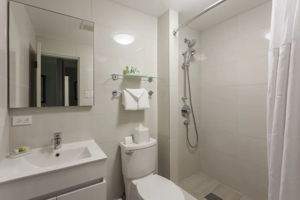 Compact bathroom with walk-in shower at Copamarina Beach Resort & Spa.