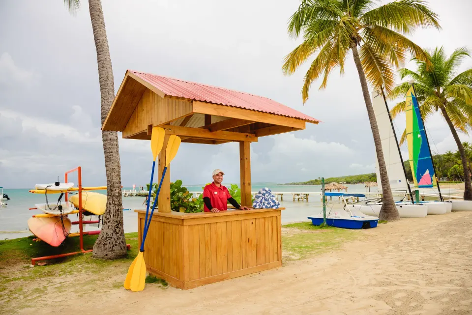 Beach activity desk with kayaks and sailboats at Copamarina Beach Resort & Spa.