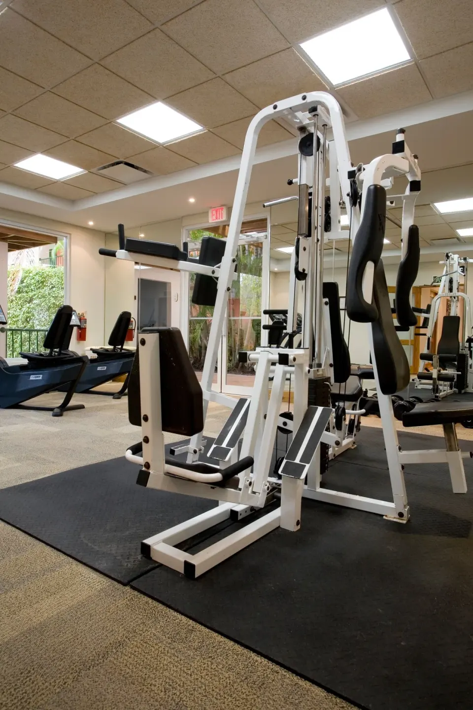 Fitness room with strength machines and cardio equipment at Copamarina Beach Resort & Spa.