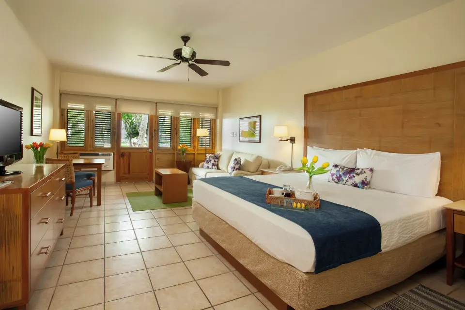 Spacious guest room with king bed and sitting area at Copamarina Beach Resort & Spa.