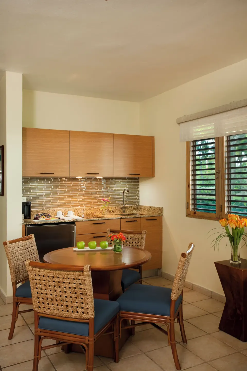 In-room kitchenette and round dining table at Copamarina Beach Resort & Spa.