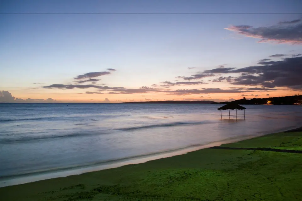 Sunset shoreline and calm water at Copamarina Beach Resort & Spa.