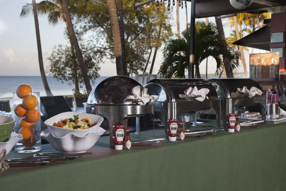 Breakfast buffet with chafing dishes and fruit near the beach at Copamarina Beach Resort & Spa.