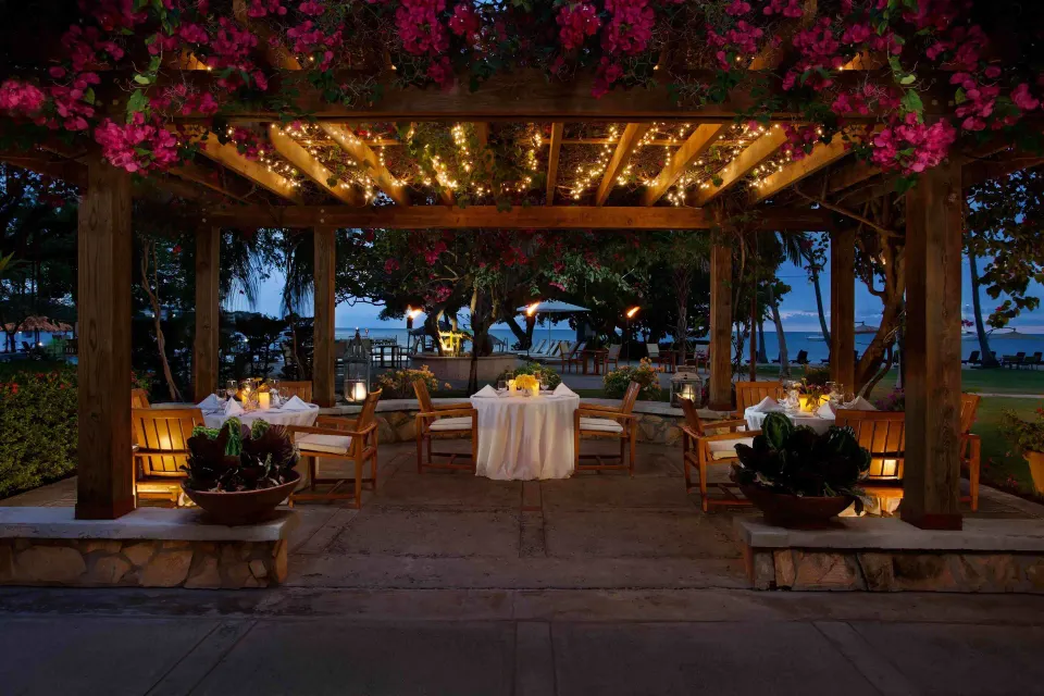 Pergola dining setup with string lights at Copamarina Beach Resort & Spa.
