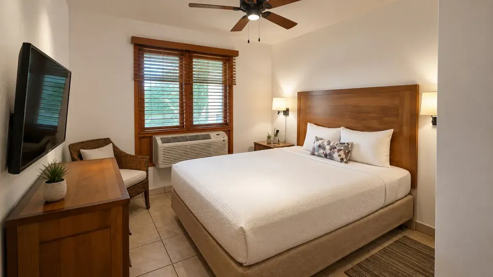 King bedroom in a Luxury Three-Bedroom Villa at Copamarina Beach Resort & Spa with wall-mounted TV.