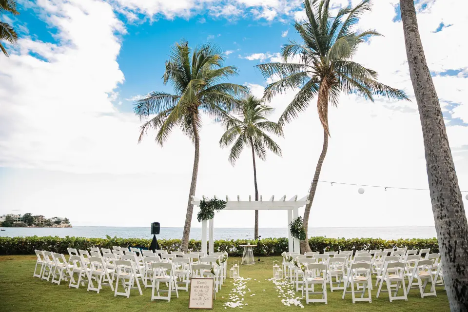 Beachfront wedding ceremony setup on the lawn at Copamarina Beach Resort & Spa.