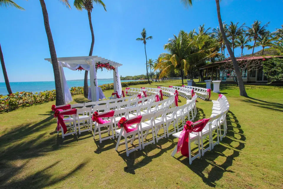 Oceanfront wedding ceremony chairs and arch at Copamarina Beach Resort & Spa.