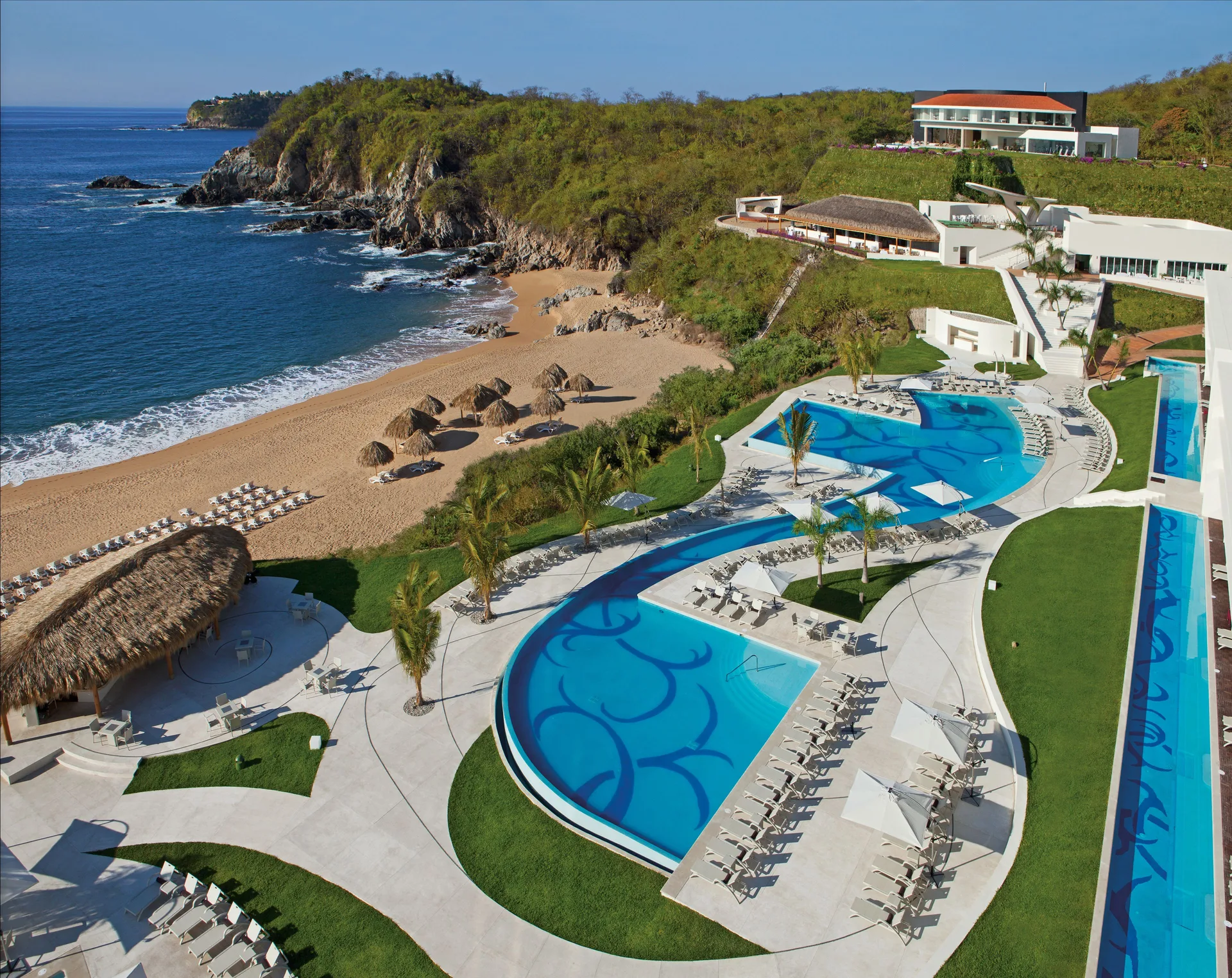 Secrets Huatulco Resort and Spa adults-only all-inclusive with beachfront pools, Unlimited-Luxury amenities, and Pacific Ocean setting.