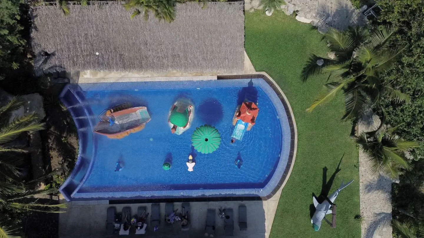 Overhead view of the children’s pool with play figures at Coral Blue Huatulco.