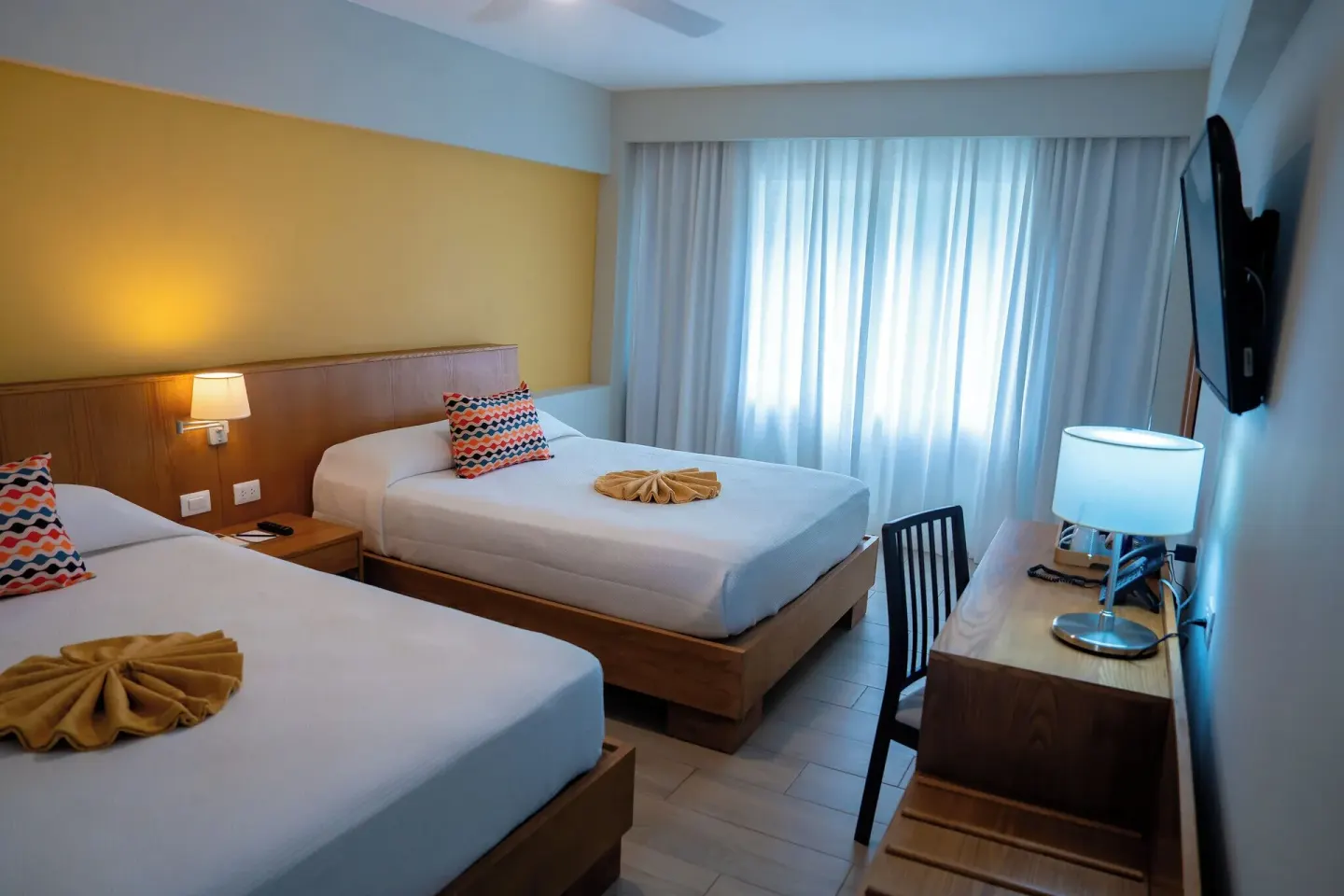 Standard Room Garden View with two beds and desk at Coral Costa Caribe Beach Resort
