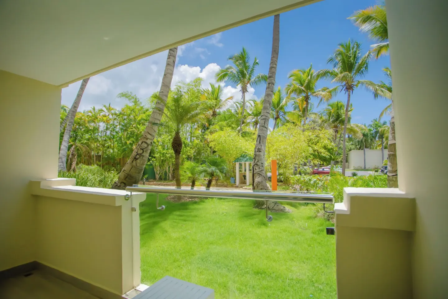 Garden-view balcony with palms at Coral Costa Caribe Beach Resort.