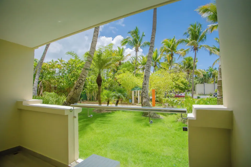 Garden-view balcony with palms at Coral Costa Caribe Beach Resort.