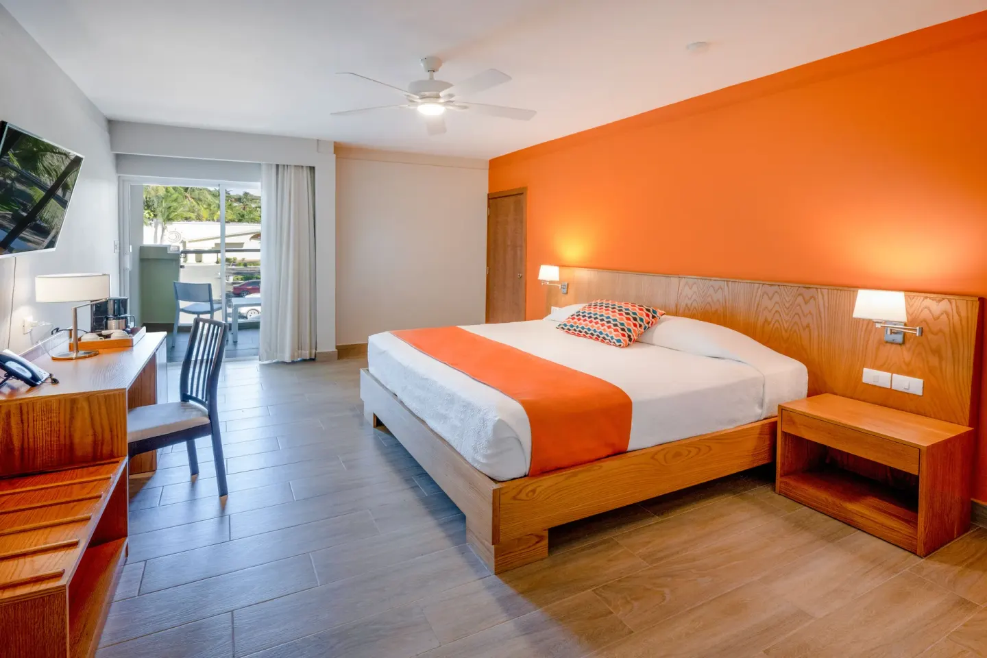 Superior Room with king bed and balcony at Coral Costa Caribe Beach Resort.