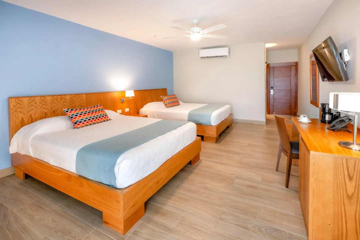 Superior Room with two beds and desk at Coral Costa Caribe Beach Resort.