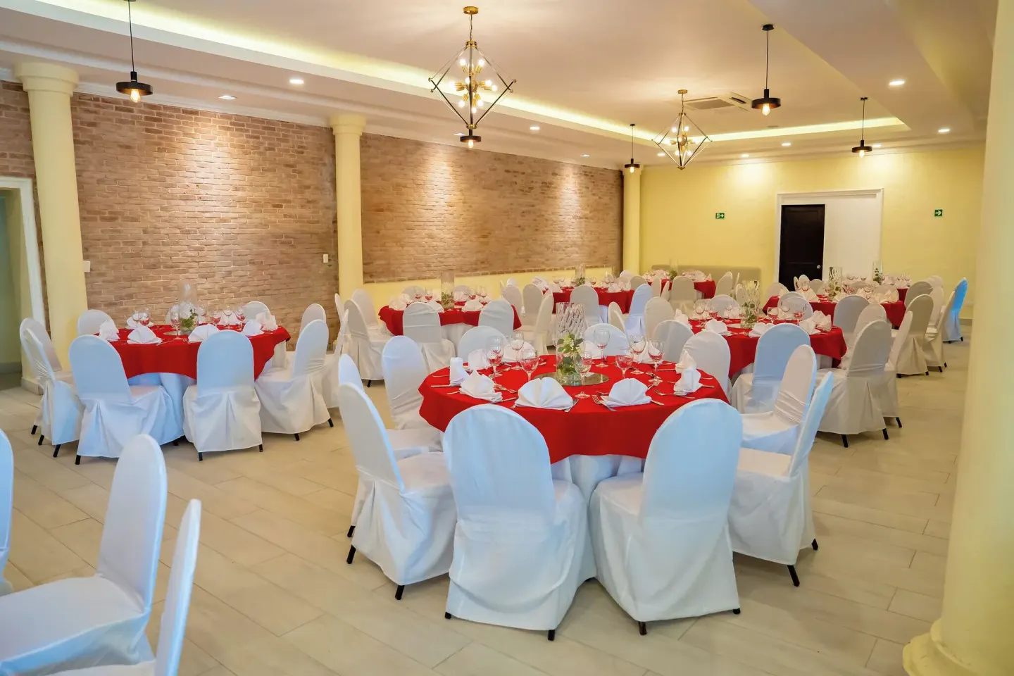 Banquet room with red table linens at Coral Costa Caribe Beach Resort.