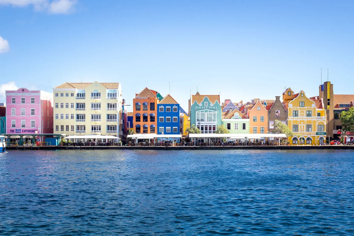 Colorful waterfront buildings in Willemstad near Coral Estate Luxury Resort.