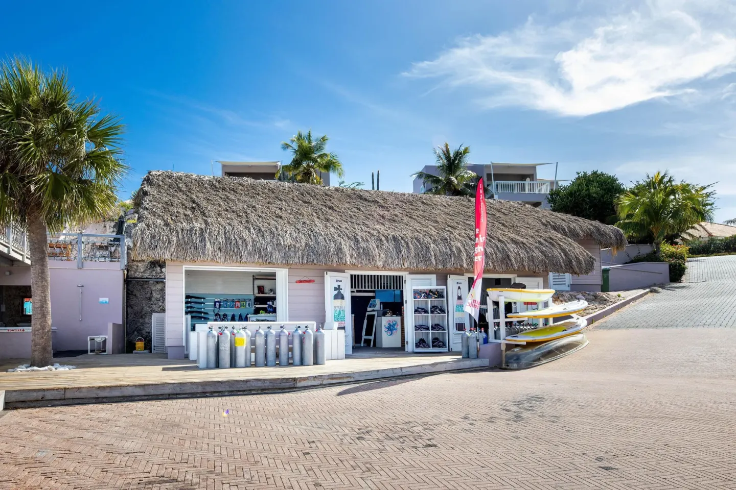 Thatched dive and water-sports shop at Coral Estate Luxury Resort.