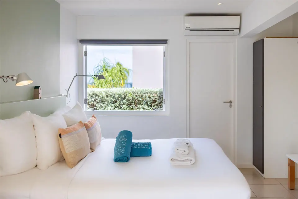 Deluxe apartment bedroom with garden-facing window at Coral Estate Luxury Resort.