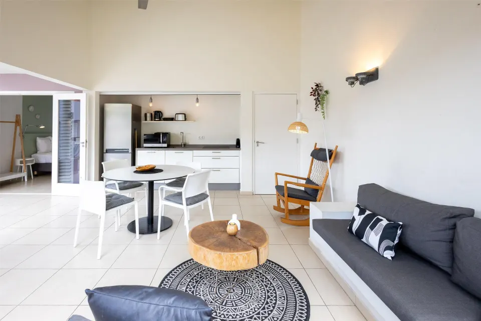 Open apartment living area with kitchenette at Coral Estate Luxury Resort.