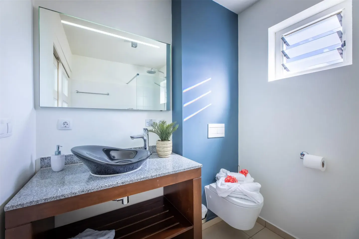 Deluxe Room Garden View bathroom vanity at Coral Estate Luxury Resort.