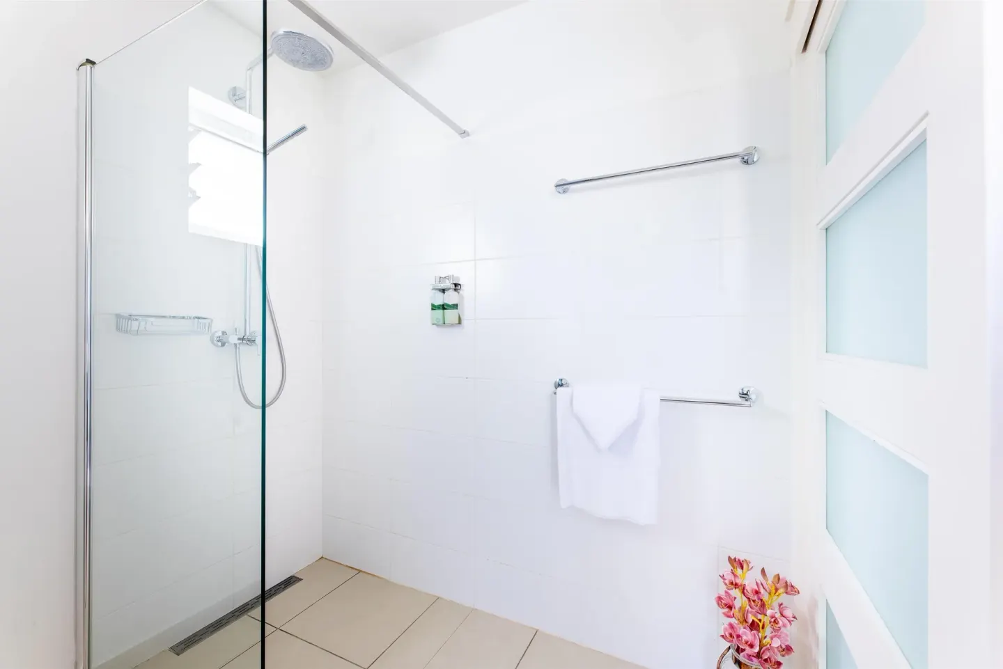 Deluxe Room Garden View glass shower at Coral Estate Luxury Resort.