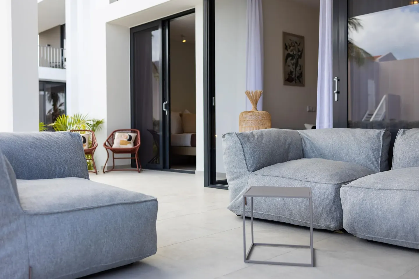 Premium Villa terrace sofas outside sliding doors at Coral Estate Luxury Resort.