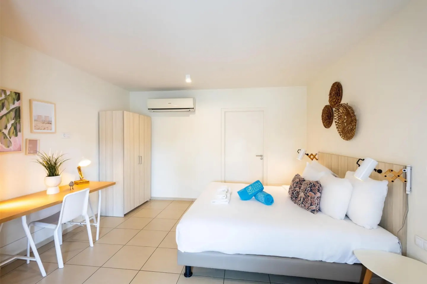 Superior Apartment bedroom with bed, desk, wardrobe, and air conditioner at Coral Estate Luxury Resort.