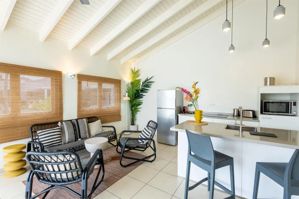 Garden-view apartment lounge with kitchenette at Coral Estate Luxury Resort.