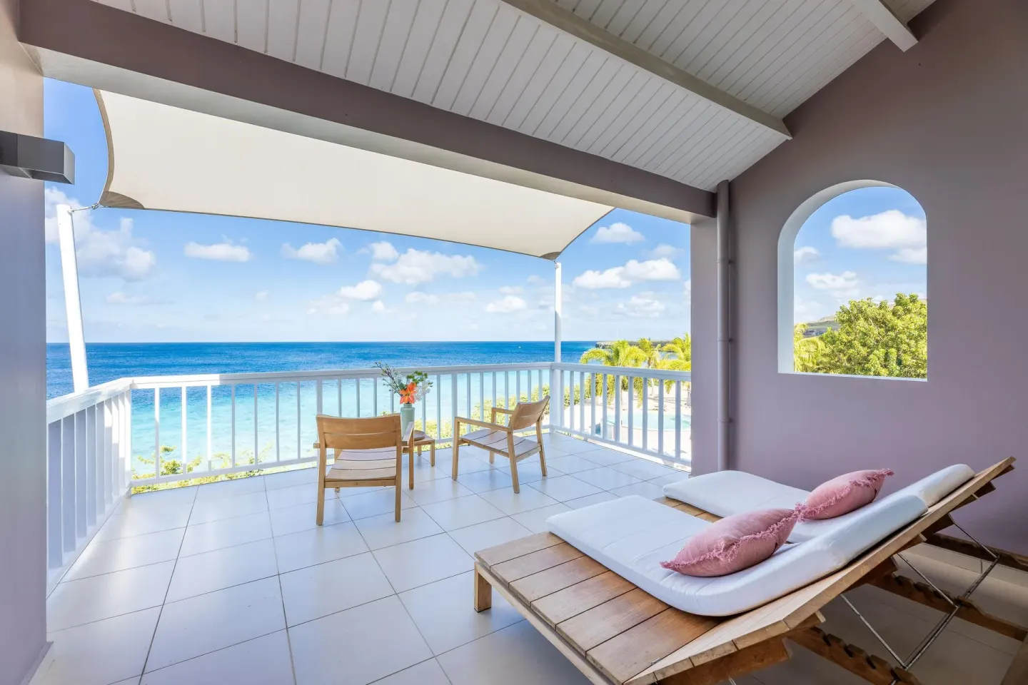 Superior Oceanfront terrace with loungers and sea view at Coral Estate Luxury Resort.