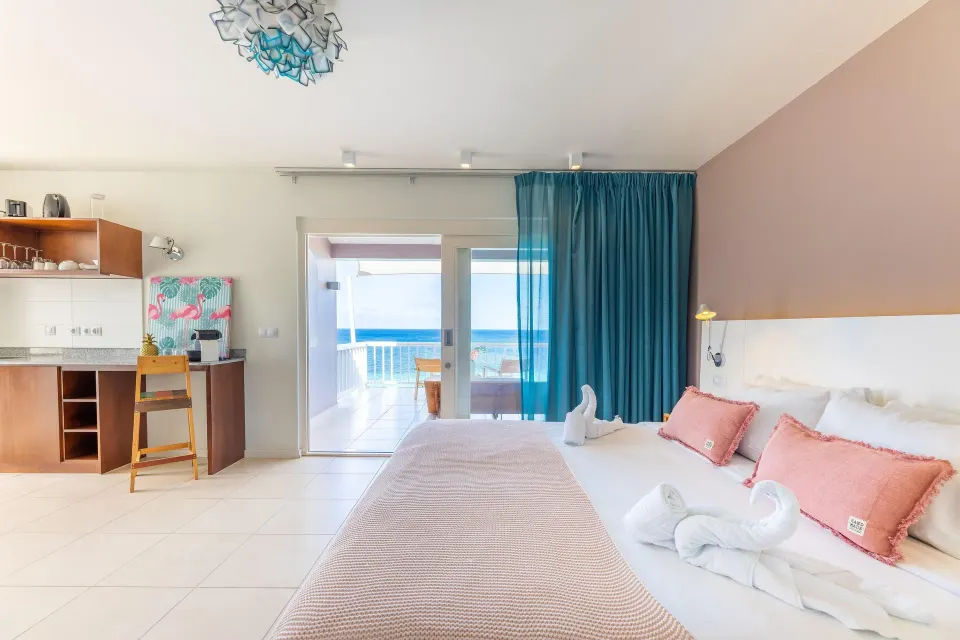 Superior Oceanfront room with twin beds and kitchenette at Coral Estate Luxury Resort.