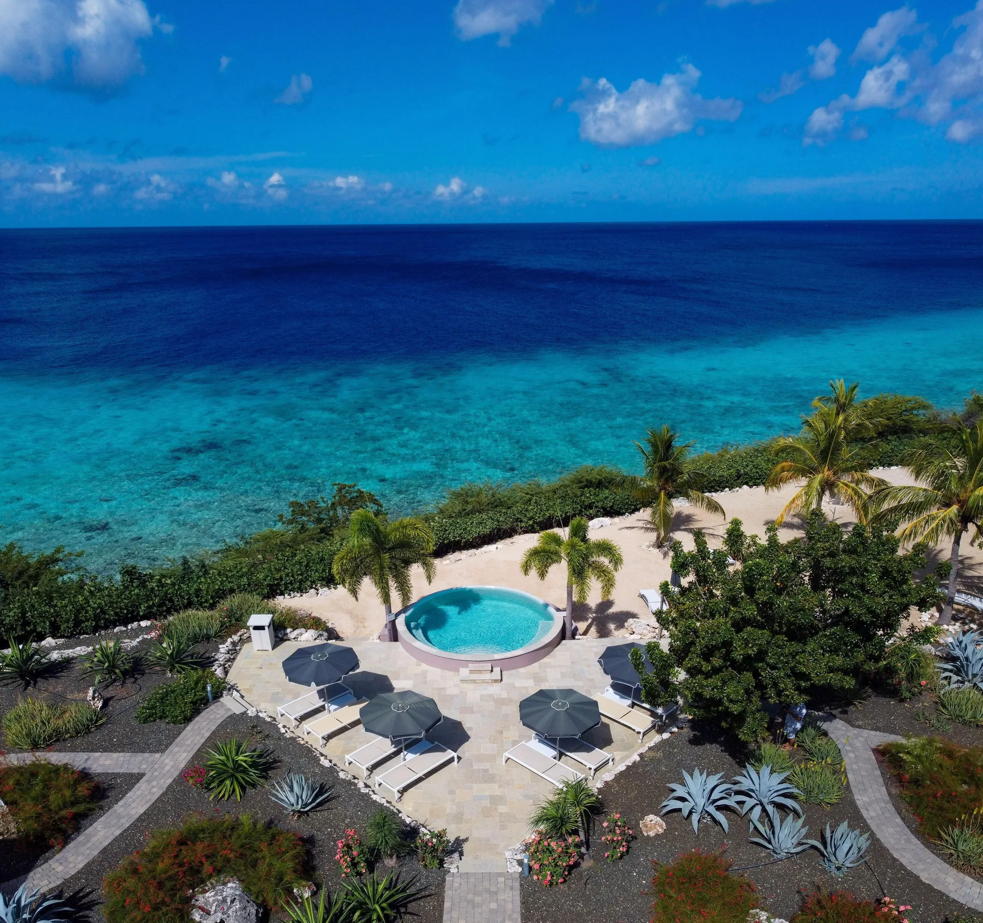 Aerial view of the oceanfront VIP area pool at Coral Estate Luxury Resort.