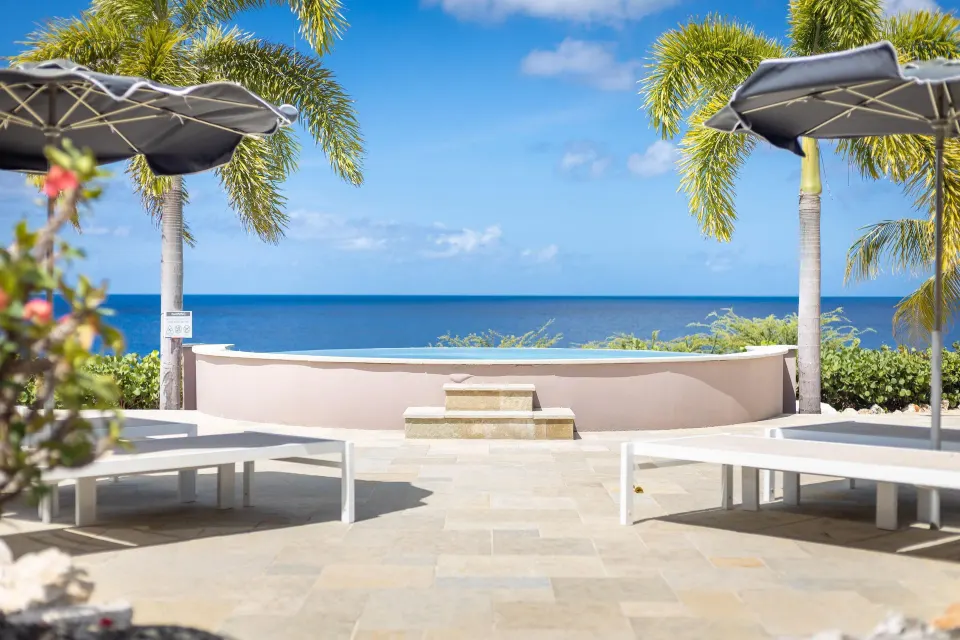 Oceanfront VIP area loungers and plunge pool at Coral Estate Luxury Resort.