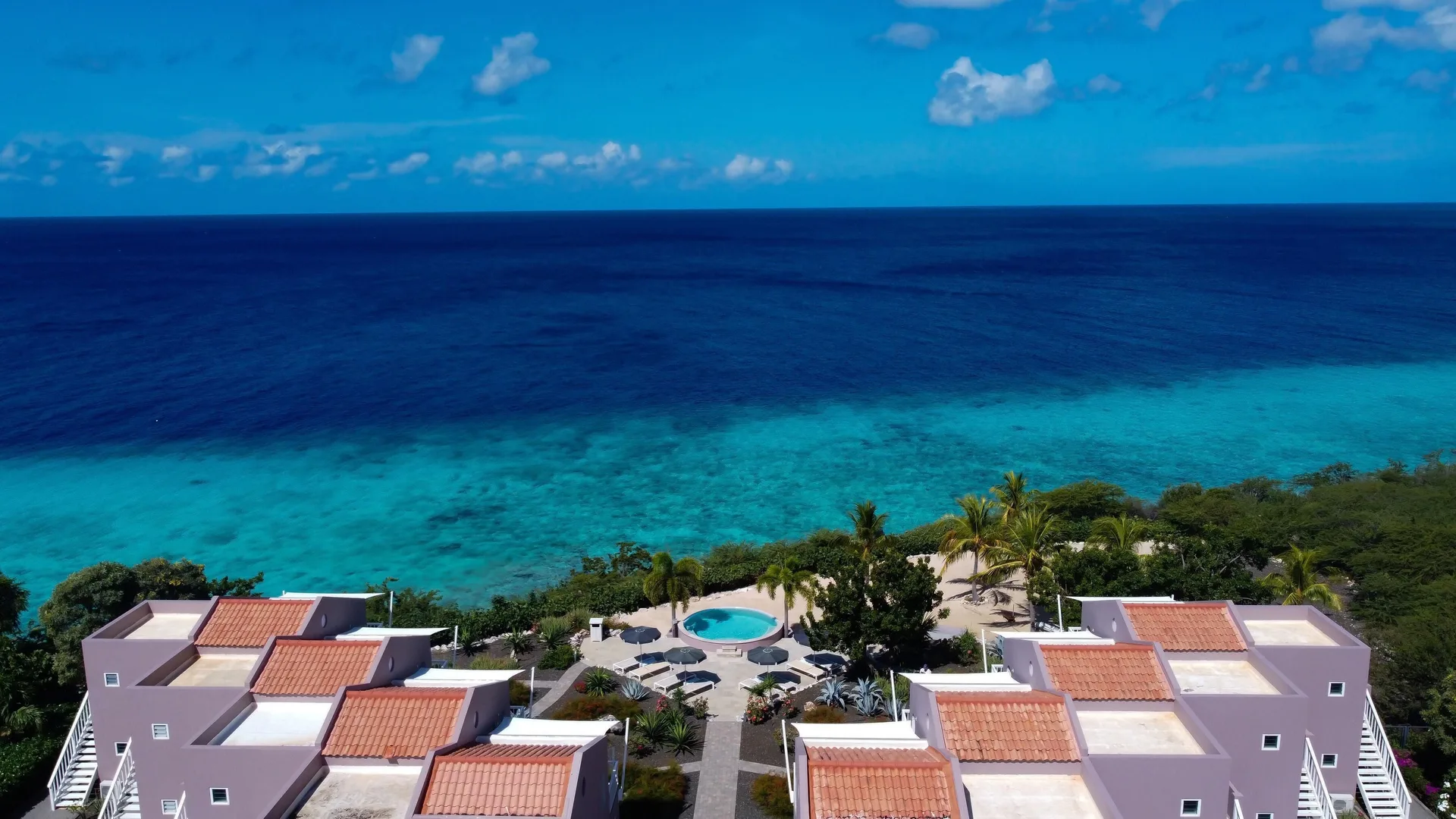 Aerial ocean view over VIP area room rooftops at Coral Estate Luxury Resort.
