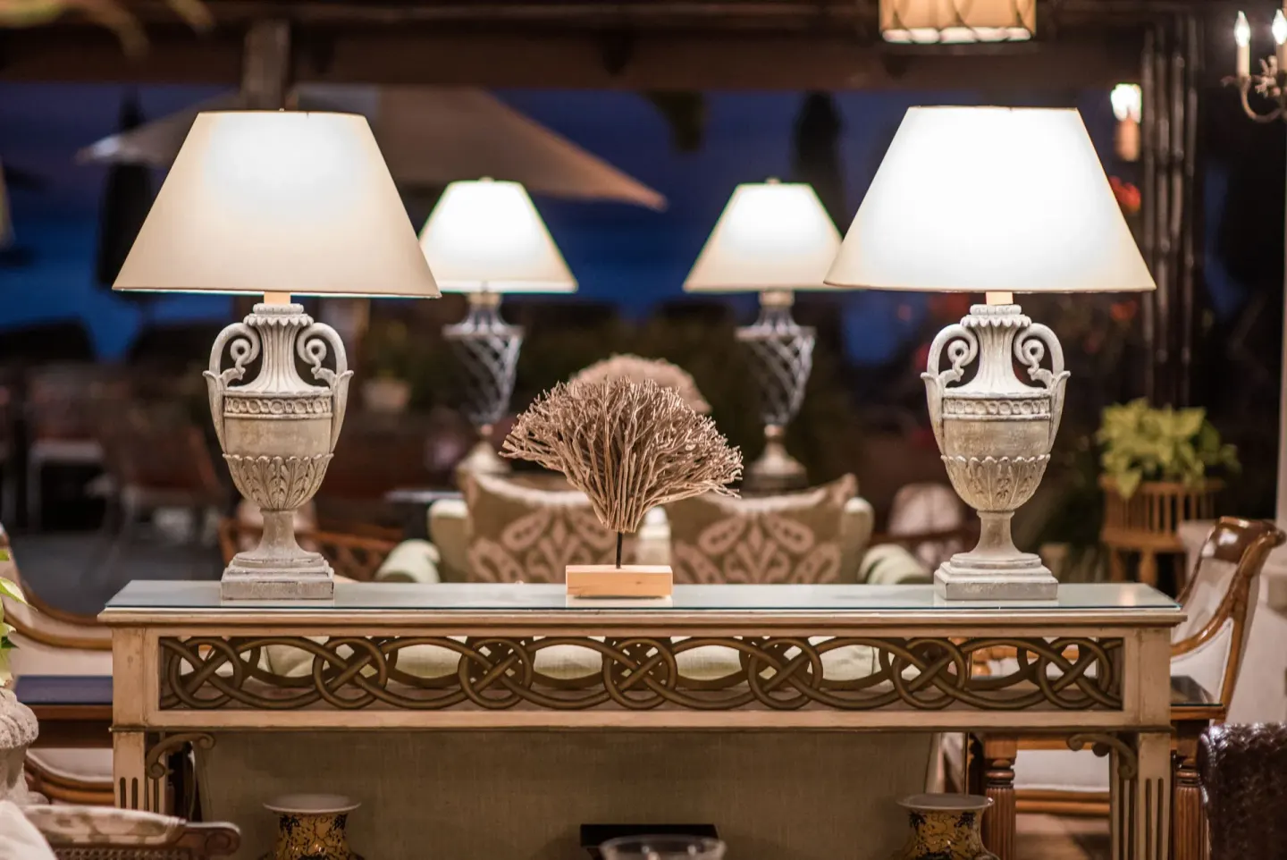 Table lamps and coral decor in a lounge at Coral Reef Club.